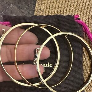Kate Spade Black and Gold Bow Bangles a bundle of three